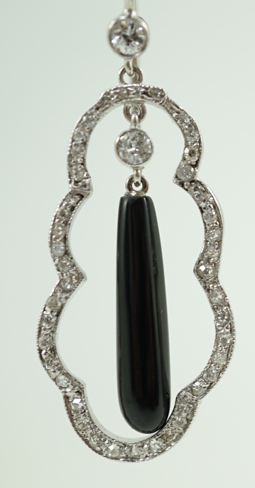A pair of 20th century white gold, black onyx and diamond cluster set drop earrings